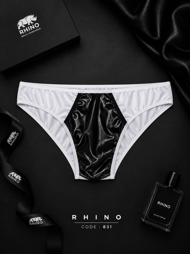 شورت مردانه فانتزی برند Rhino ترکیبی از فلامنت و چرم فریسایز کد 831 نمایش داده شده با بستهبندی و عطر